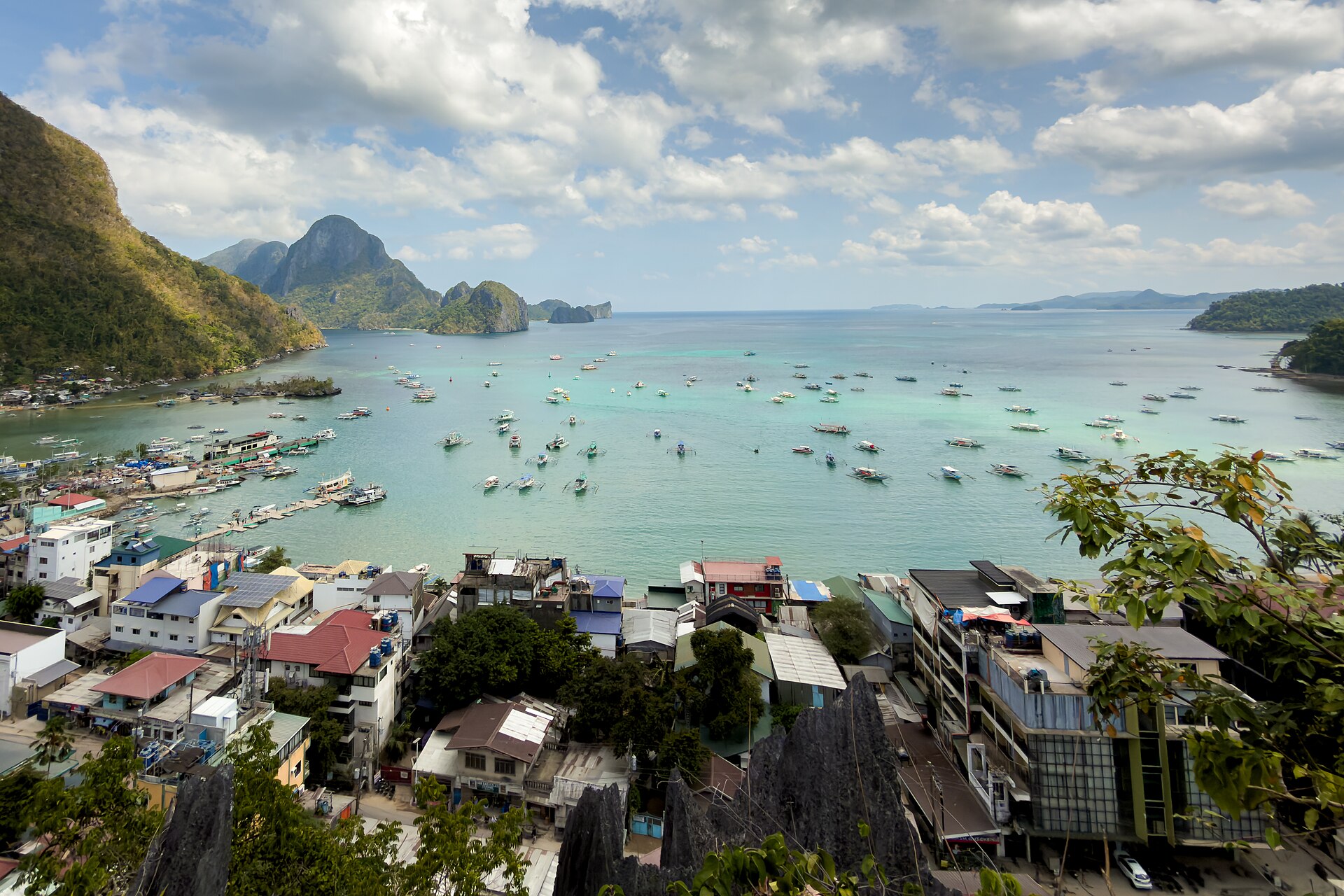 El Nido town and Bacuit Bay, with limestone islands and outrigger boats